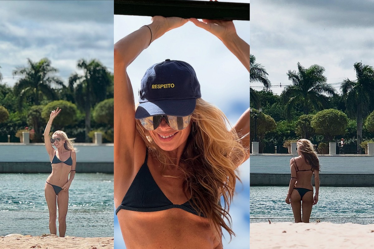 De férias na praia, Adriane Galisteu brinca com pose 'frente e verso'